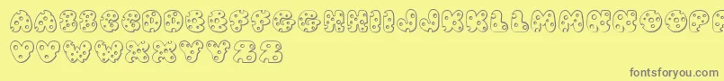 Fonte JI Swiss Cheese – fontes cinzas em um fundo amarelo