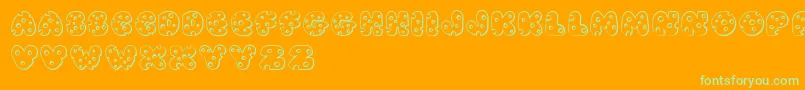 JI Swiss Cheese-Schriftart – Grüne Schriften auf orangefarbenem Hintergrund