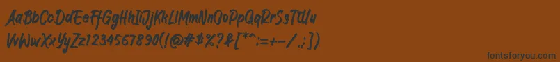 フォントJIANGKRIK – 黒い文字が茶色の背景にあります