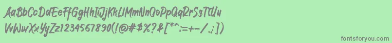 フォントJIANGKRIK – 緑の背景に灰色の文字