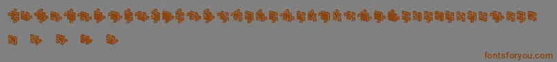 フォントJigsawPuzzles3DFilled – 茶色の文字が灰色の背景にあります。