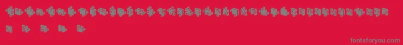 JigsawPuzzles3DFilled-fontti – harmaat kirjasimet punaisella taustalla