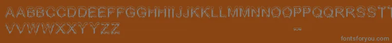 Jizz Mass   BC Font – Gray Fonts on Brown Background