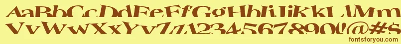 フォントTroug – 茶色の文字が黄色の背景にあります。