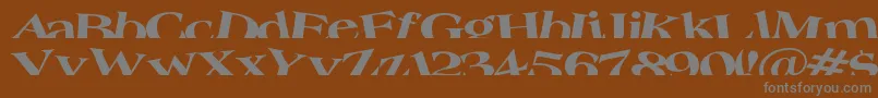 Troug-fontti – harmaat kirjasimet ruskealla taustalla