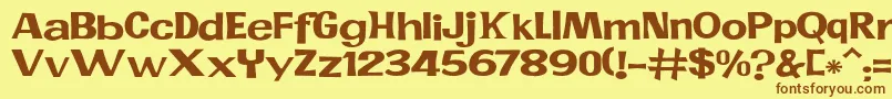 フォントJMH PR EXP – 茶色の文字が黄色の背景にあります。