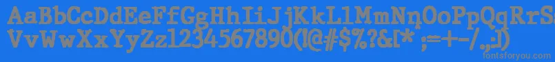 フォントJMH Typewriter Black – 青い背景に灰色の文字