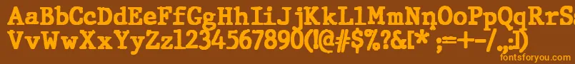 フォントJMH Typewriter Black – オレンジ色の文字が茶色の背景にあります。