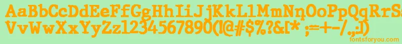 フォントJMH Typewriter Black – オレンジの文字が緑の背景にあります。
