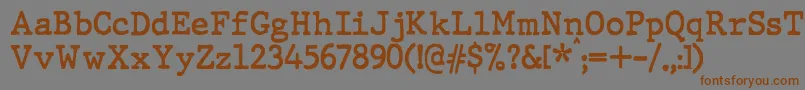 JMH Typewriter Bold-Schriftart – Braune Schriften auf grauem Hintergrund