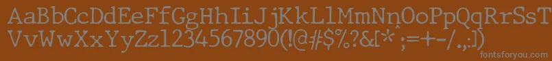 JMH Typewriter dry Thin-Schriftart – Graue Schriften auf braunem Hintergrund