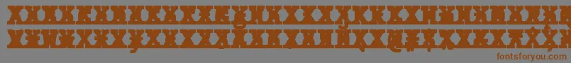 フォントJMH Typewriter mono Black Cross – 茶色の文字が灰色の背景にあります。