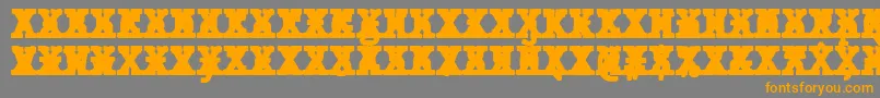 フォントJMH Typewriter mono Black Cross – オレンジの文字は灰色の背景にあります。