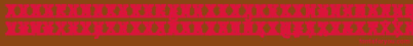 フォントJMH Typewriter mono Black Cross – 赤い文字が茶色の背景にあります。