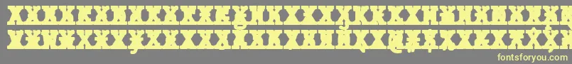 フォントJMH Typewriter mono Black Cross – 黄色のフォント、灰色の背景