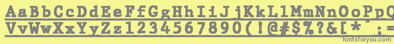 Шрифт JMH Typewriter mono Black Under – серые шрифты на жёлтом фоне
