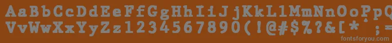 JMH Typewriter mono Black-Schriftart – Graue Schriften auf braunem Hintergrund