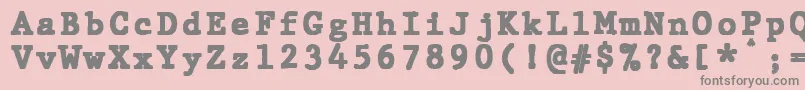 フォントJMH Typewriter mono Black – ピンクの背景に灰色の文字