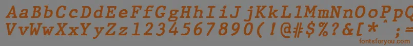 フォントJMH Typewriter mono Bold Italic – 茶色の文字が灰色の背景にあります。