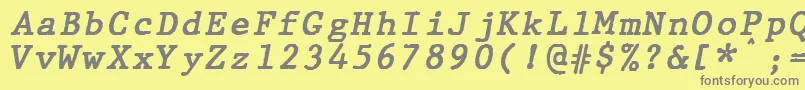 フォントJMH Typewriter mono Bold Italic – 黄色の背景に灰色の文字