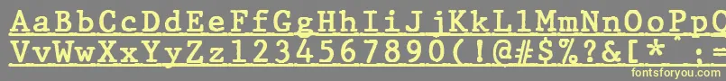 Шрифт JMH Typewriter mono Bold Under – жёлтые шрифты на сером фоне