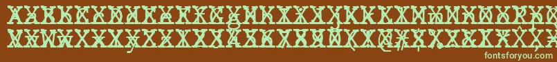 Fonte JMH Typewriter mono Cross – fontes verdes em um fundo marrom