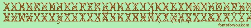 フォントJMH Typewriter mono Fine Cross – 緑の背景に茶色のフォント