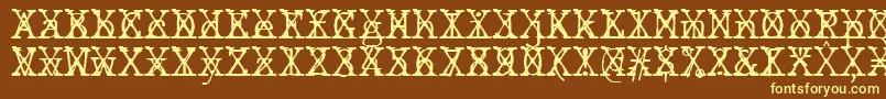 JMH Typewriter mono Fine Cross-fontti – keltaiset fontit ruskealla taustalla