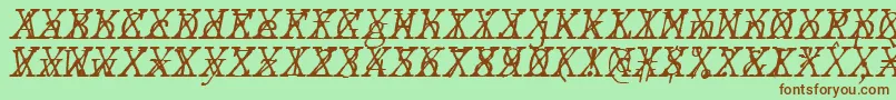 JMH Typewriter mono Fine Italic Cross-fontti – ruskeat fontit vihreällä taustalla