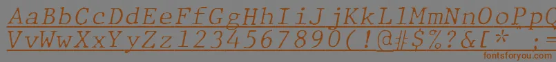 フォントJMH Typewriter mono Fine Italic Under – 茶色の文字が灰色の背景にあります。