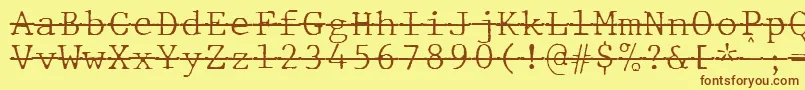 Шрифт JMH Typewriter mono Fine Over – коричневые шрифты на жёлтом фоне
