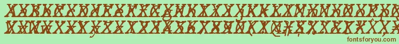 JMH Typewriter mono Italic Cross-fontti – ruskeat fontit vihreällä taustalla