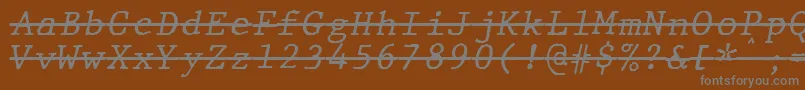Czcionka JMH Typewriter mono Italic Over – szare czcionki na brązowym tle