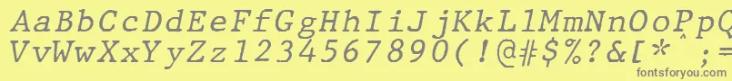 JMH Typewriter mono Italic-Schriftart – Graue Schriften auf gelbem Hintergrund