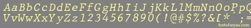 JMH Typewriter mono Italic-fontti – keltaiset fontit harmaalla taustalla