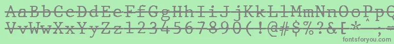 JMH Typewriter mono Over-fontti – harmaat kirjasimet vihreällä taustalla