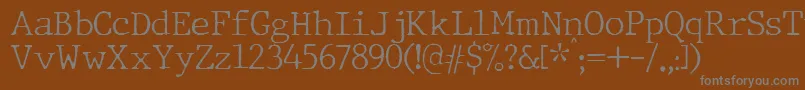 Więcej informacji o czcionce JMH Typewriter Thin Czcionka JMH Typewriter Thin – szare czcionki na brązowym tle
