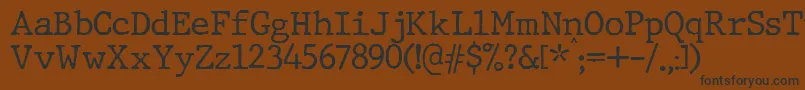 JMH Typewriter Font – Black Fonts on Brown Background