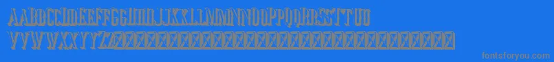 Jocker Extrude Right-fontti – harmaat kirjasimet sinisellä taustalla