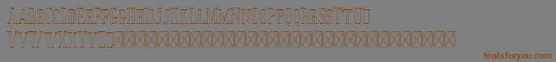 フォントJocker Outline – 茶色の文字が灰色の背景にあります。