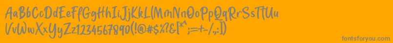 Шрифт Jotilla Font by 7NTypes – серые шрифты на оранжевом фоне