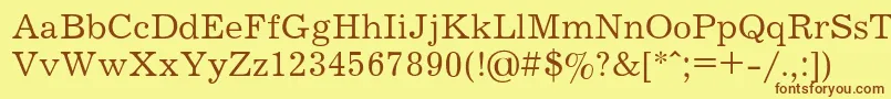 フォントJOURNAL – 茶色の文字が黄色の背景にあります。