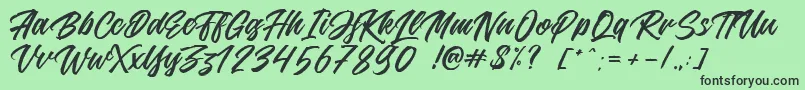 Jouska Font – Black Fonts on Green Background