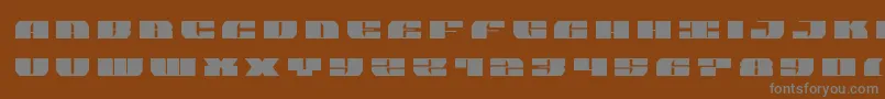 joysharktitle-fontti – harmaat kirjasimet ruskealla taustalla
