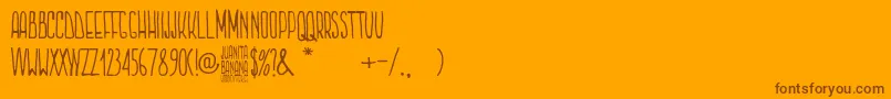Juanita Banana-Schriftart – Braune Schriften auf orangefarbenem Hintergrund