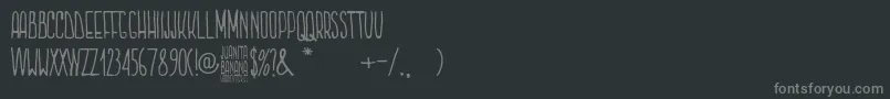 Więcej informacji o czcionce Juanita Banana Czcionka Juanita Banana – szare czcionki na czarnym tle
