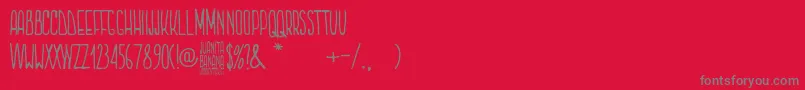 Juanita Banana-Schriftart – Graue Schriften auf rotem Hintergrund