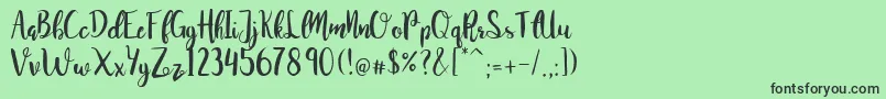 JuanitaBrushSmooth Font – Black Fonts on Green Background