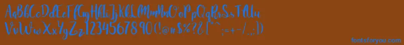 JuanitaBrushSmooth Font – Blue Fonts on Brown Background