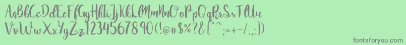 JuanitaBrushSmooth Font – Gray Fonts on Green Background